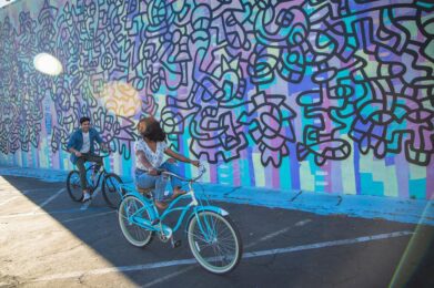Bike in front of murals